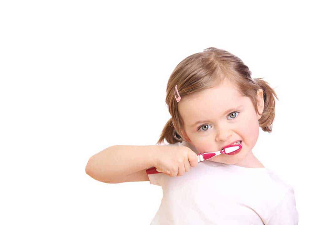 A Child Brushing Her Teeth