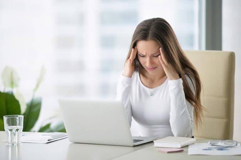 Woman with stress and anxiety at work