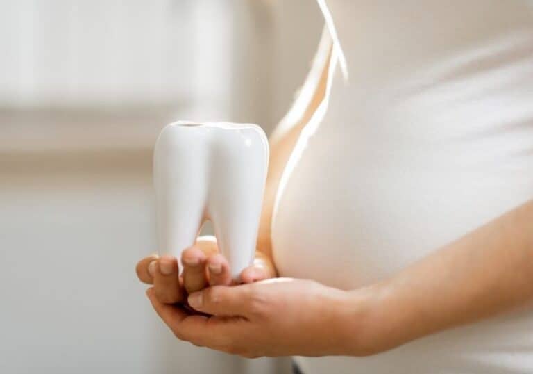 A pregnant woman and a tooth