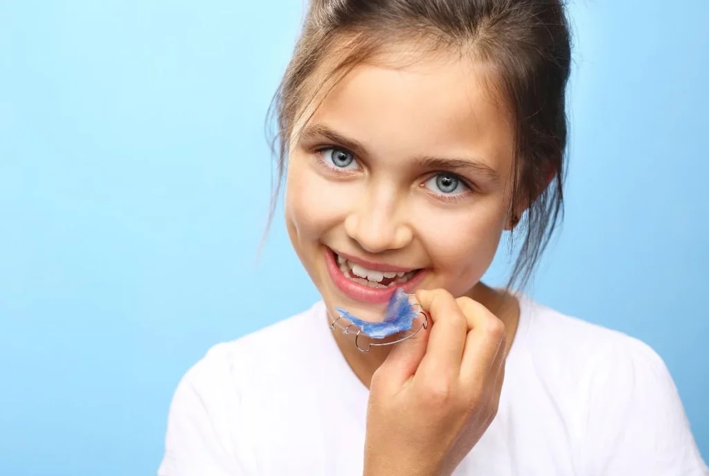 Pretty girl with colored orthodontic